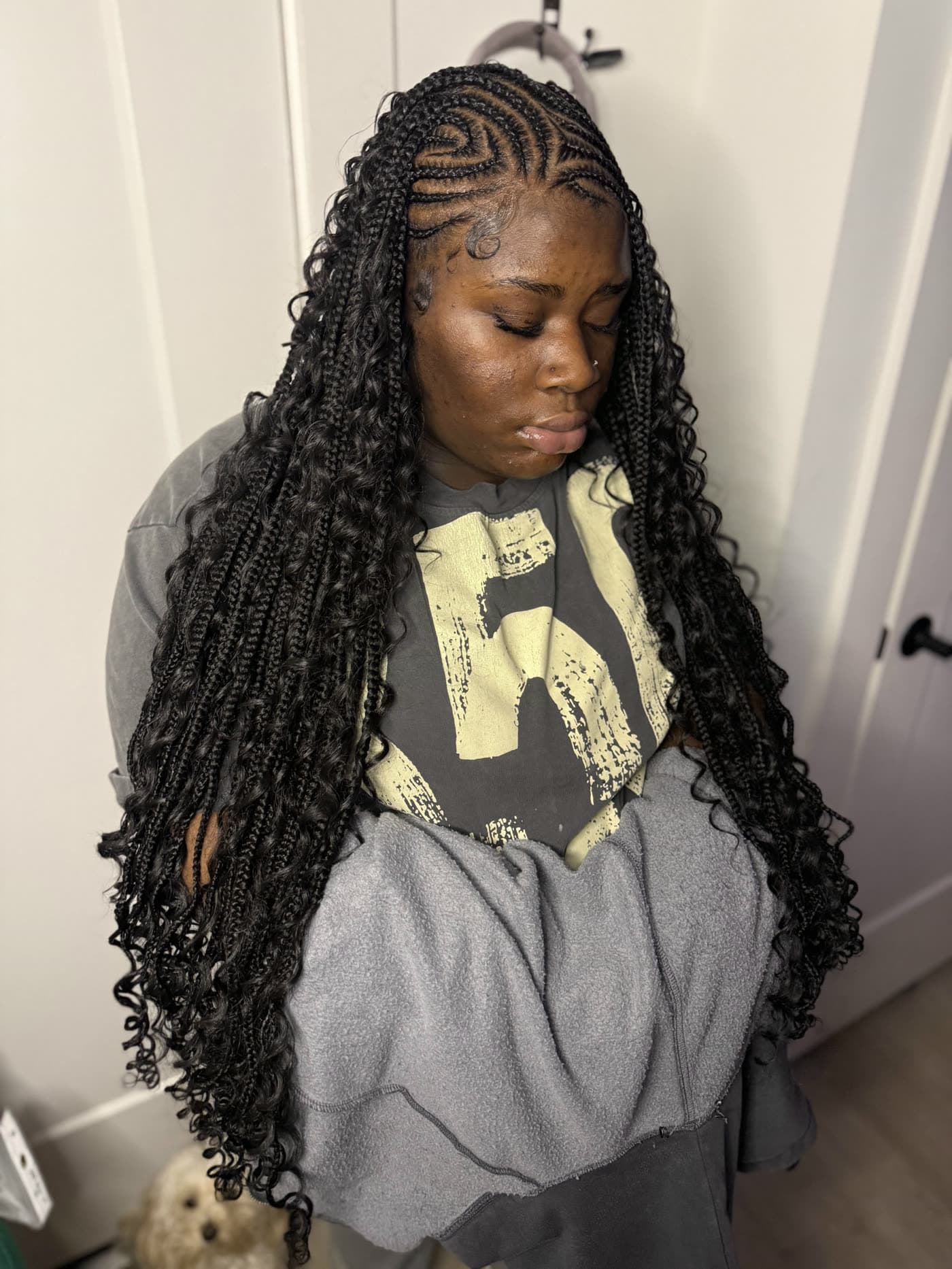 Long boho knotless braids with curly ends, front view