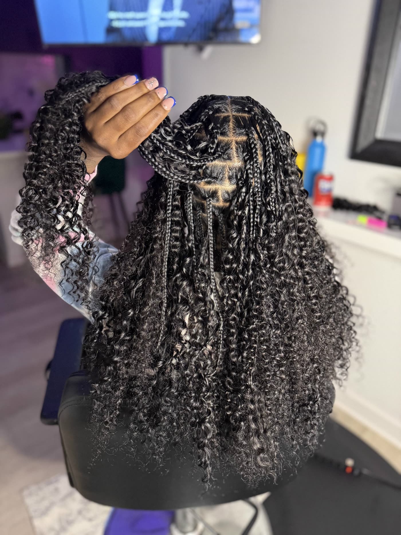Boho knotless braids showing a clean centre part and even sections