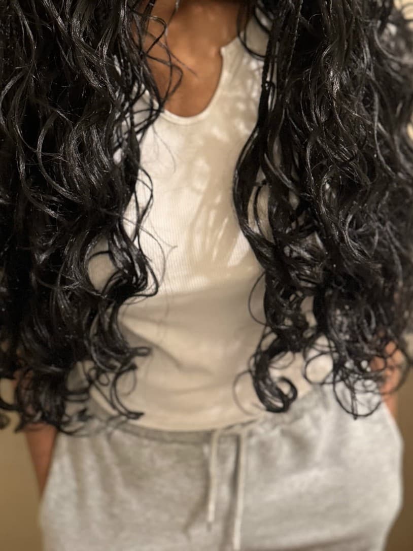 Long boho braids with soft wavy ends falling past the waist